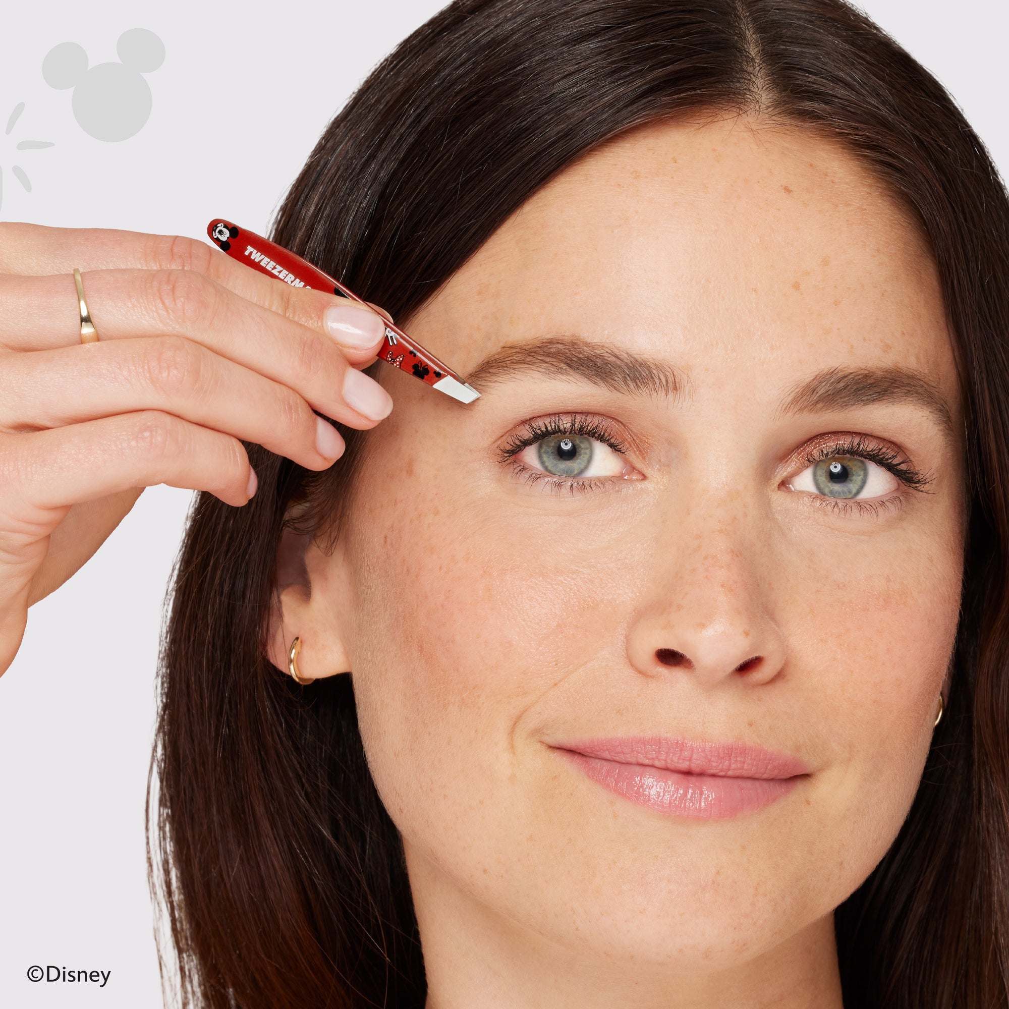 Model Using We Got ears Mini Slant Tweezer