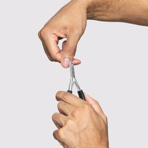 Male Model hands using Great Grip Cuticle Nipper to cut nail cuticles